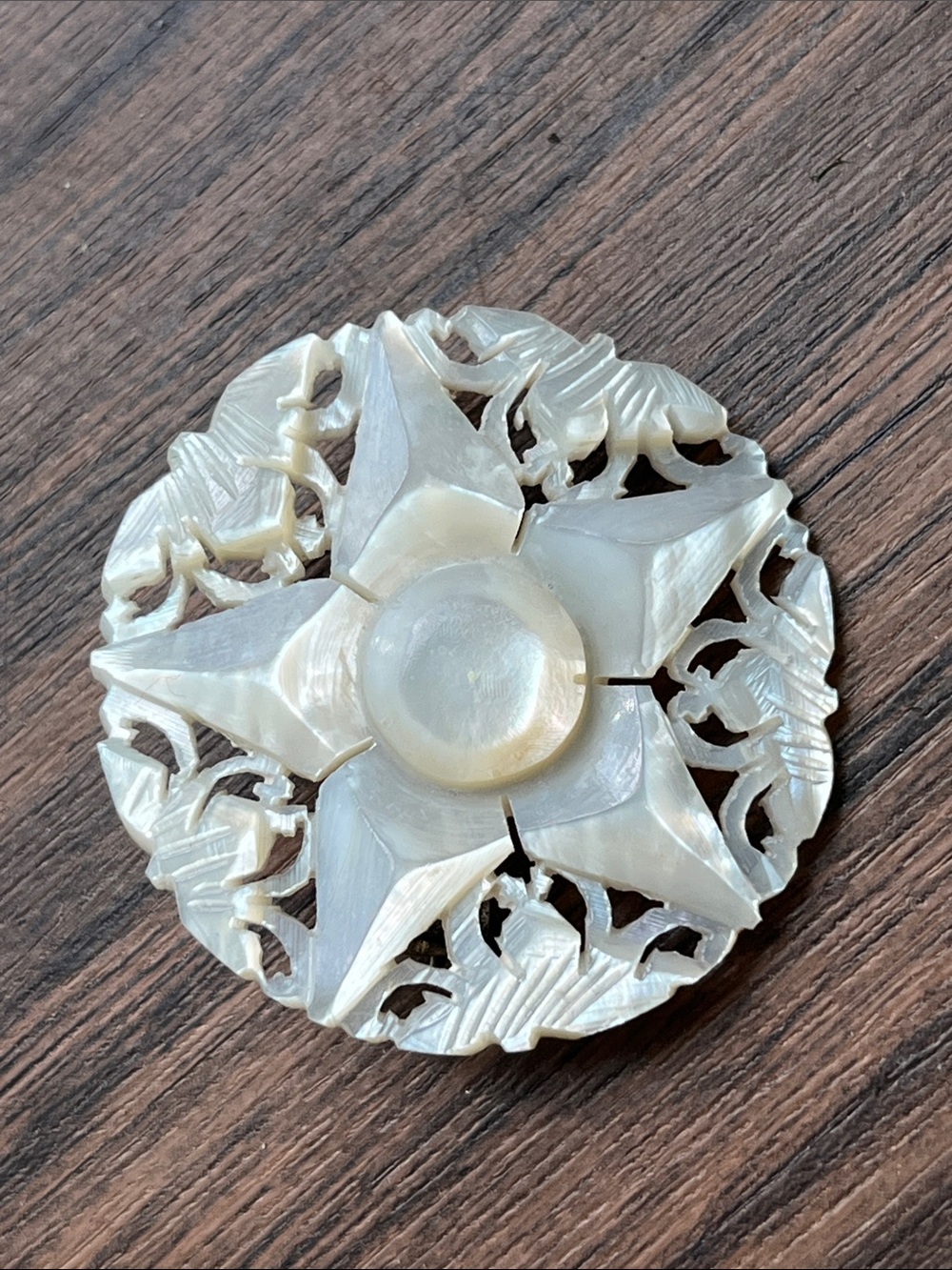 Vintage carved mother of pearl star brooch